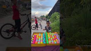 Your watching are children smiling small boy enjoy to play puzzles balls game