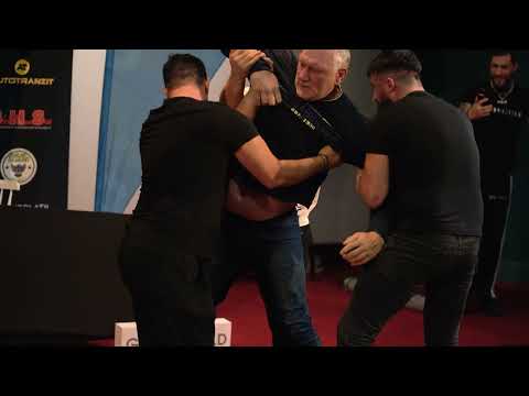 Tolea threw Pascu across the tables trying to get to Neveu. Scandal at the HEROES 10 conference