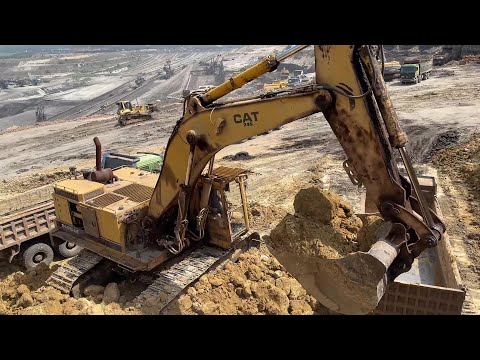 The Old Hero Caterpillar 245B Excavator Loading Mercedes & MAN Trucks