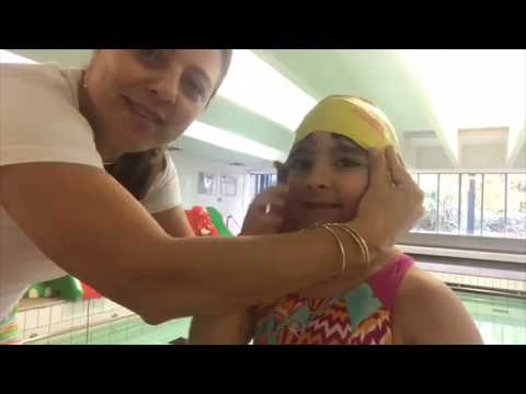 1-min video to show you how to put a swim cap over your child's head
