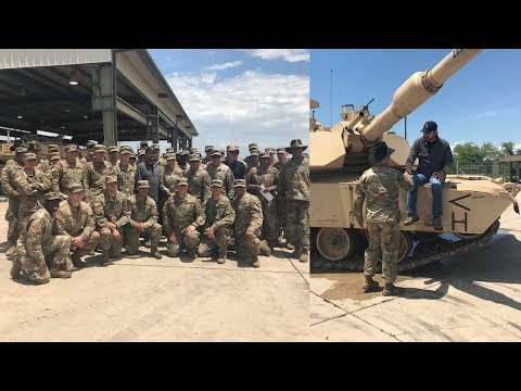 Chuck Norris Climbs On Army Tank While Visiting Soldiers
