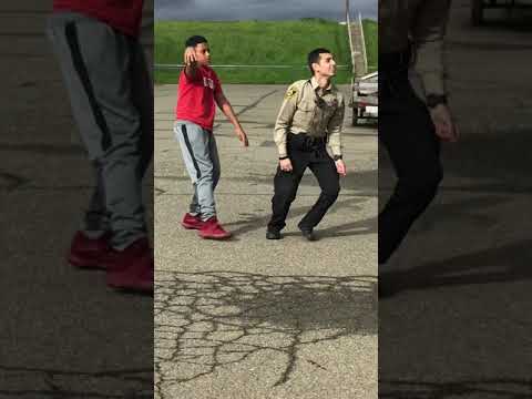 Hecka cool cop plays basketball with kids