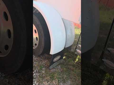Mahindra 6025 tractor pulling a tree