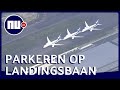 Luchtbeeld toont geparkeerde toestellen op enorm vliegveld Tokio | NU nl