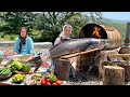 Giant Fish Cooked In A Metal Barrel Over Fire Village Bread On Saj