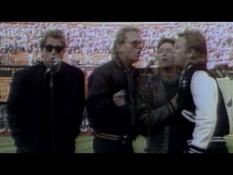 1987 NLCS Gm3: Huey Lewis & the News perform the national anthem before Game 3 of the NLCS