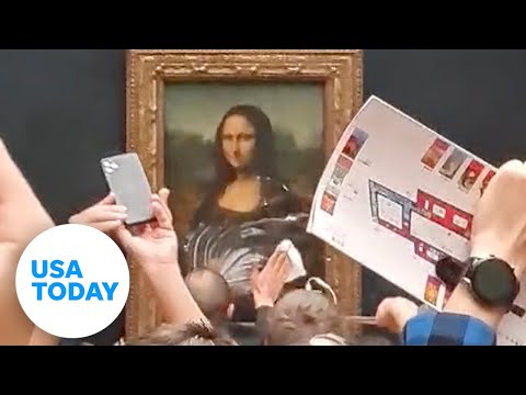 Man throws cake at Mona Lisa painting at Louvre Museum in Paris USA TODAY