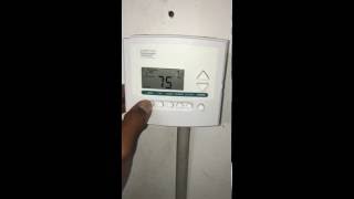 Going through the various Mode options on a Commercial Programmable Thermostat