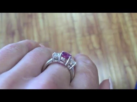 Pink sapphire ring with big diamonds on the side