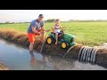 Playing in the mud and watering hay with tractors | Tractors for kids in the mud