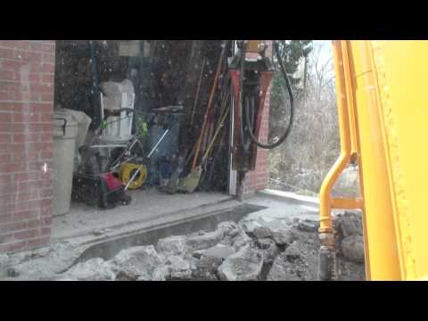 Mini excavator with jackhammer