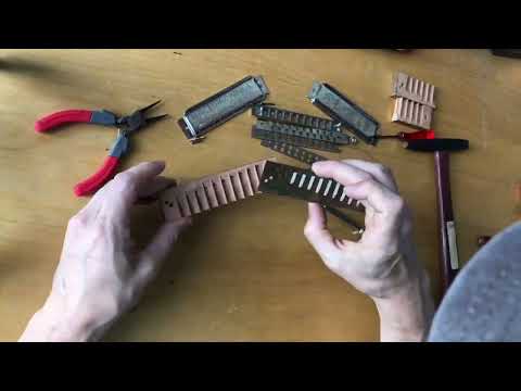 Replacing the wood comb on a Hohner Chromonica chromatic harmonica.