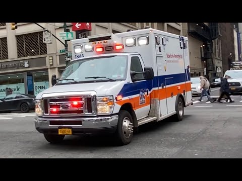 NY PRESBYTERIAN EMS AMBULANCE RESPONDING ON WEST 53RD STREET IN MIDTOWN, MANHATTAN IN NEW YORK CITY.