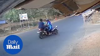 Horrifying moment a speeding motorbike crashes int