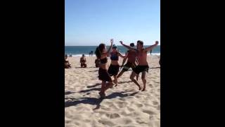 Anela practicing otea in the sand