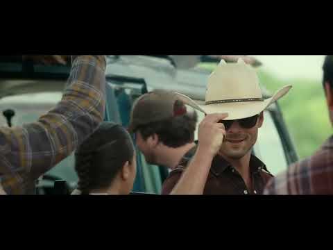 Twisters trailer image of sunlit aftermath and muddy trucks as the storm breaks