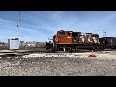 CN 5286 (Zebra Paint SD40-2W) Leads A Long CN L575 past Pennsylvania Rd. in Wyandotte, MI (4/16/24)