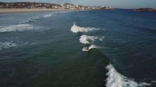Surfers at Good Harbor Beach in Gloucester, MA