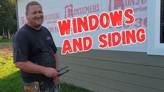Brother Dan explains process of installing windows and lap siding on new house build.