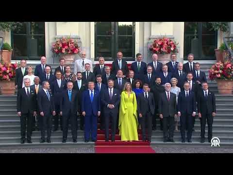 Erdogan and Trump seen shaking hands in the NATO group photo