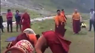 Tibetan Monk playing funny game