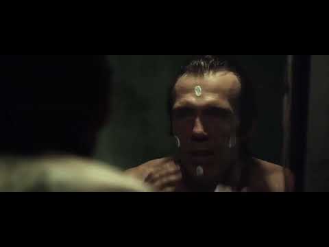 31 trailer still — Doom-Head’s face under harsh light as a cue surges