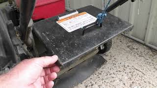 Lawnmower grass catcher keeps falling off.