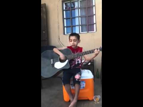 Jesus Diego plays guitar and sings 