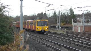 preview picture of video 'Tyne and Wear Metro-Metrocars 4070 and 4056 passing Gosforth Depot West Yard'