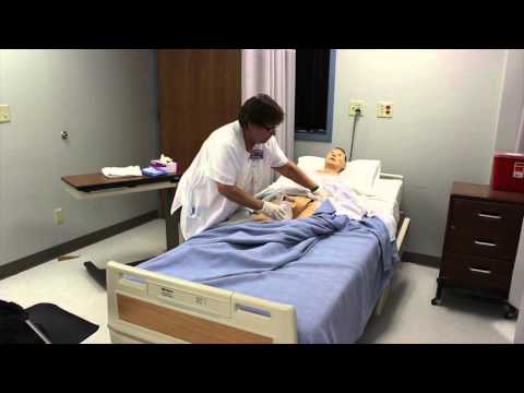 Assisting a male resident with a urinal