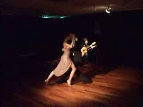  Rodrigo Palacios  and  Agustina Berenstein  are  dancing  to  a  tango