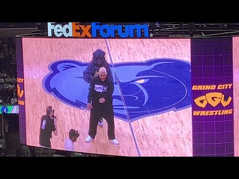 Jerry “The King” Lawler and Rikishi perform the Too Cool dance with the Memphis Grizzlies dancers