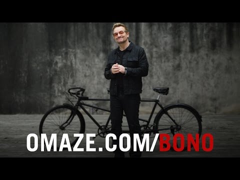 Bono invites you to ride a bike with him in NYC for (RED)
