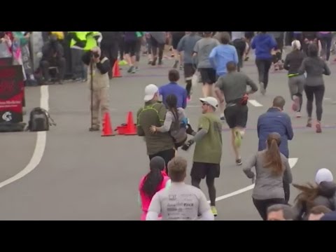 The heartwarming moment two men stop to help a woman finish her half marathon