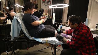 Getting a new piece during the New England Tattoo Expo