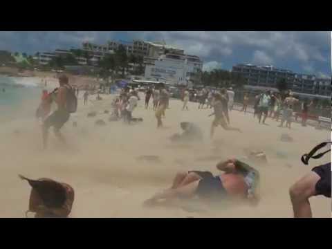 girl blown over by jet blast at Maho Beach