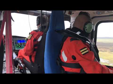 AW-169 Helicopter serving off shore wind generators taking off from Borkum island in the North Sea