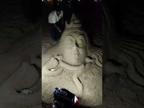 SAND ARTIST AT PURI BEACH by BISWANATH JENA