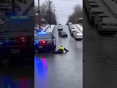 Officer Slips on Black Ice as Cars Slide Down Hill 🚓