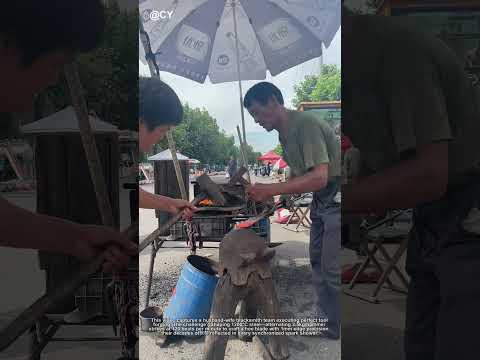 "Anvil Duet – Watch the Blacksmith Couple Forge Love into Steel with Rhythmic Sparks!"