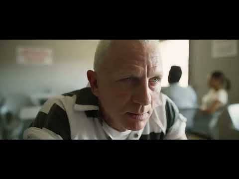 Logan Lucky trailer frame: the Logans’ primer-gray pickup idling outside a job site, West Virginia morning light