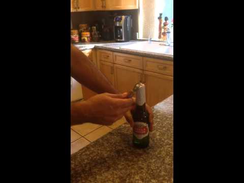 How to open a beer using a bottle opener