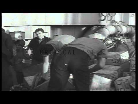 US soldiers transfer K-rations aboard transport underway in English Channel a day...HD Stock Footage