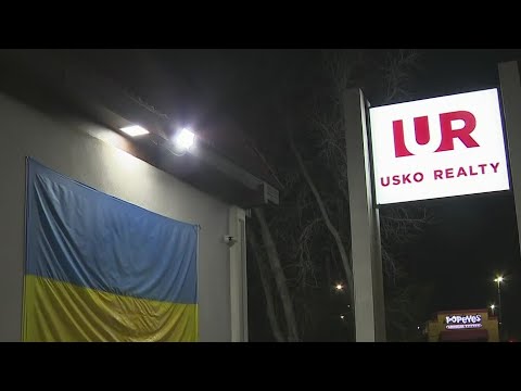 Ukrainian flag vandalized with spray painted Swastika