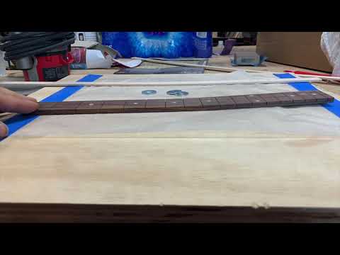 Wood guitar neck binding