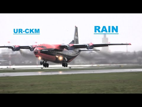 CAVOK  Antonov 12  UR-CKM  departure and take off in heavy rain, EBOS