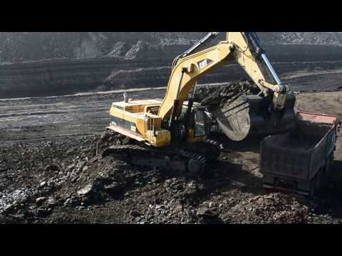 Caterpillar 385B Excavator Loading Trucks With Two Passes
