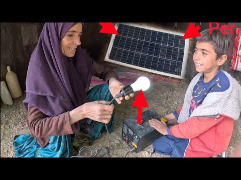 Giving a solar panel for lighting to Kabri and Hassan by the operator