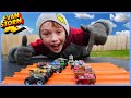 Monster Trucks VS Toy Cars In a Big Tub Of Corn