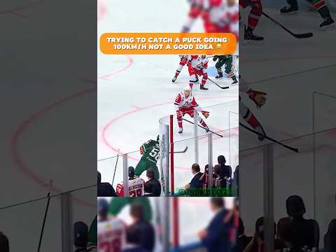 KHL player tries to catch high speed puck 😂 #nhl #hockey #sports #shorts